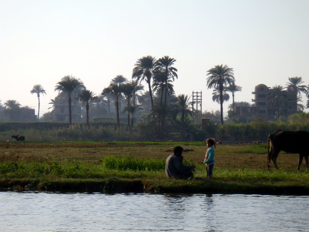 Man and child on the Nile, Luxor, Egypt