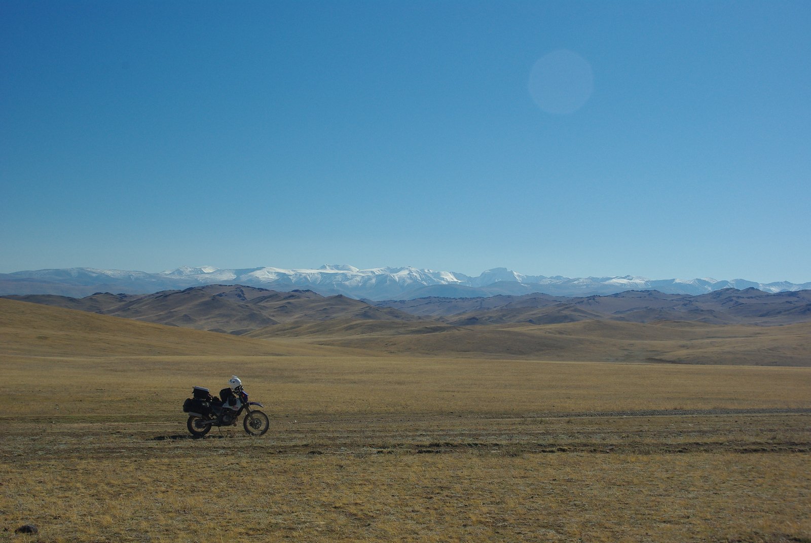 Western Mongolian steppe with snow-capped peaks